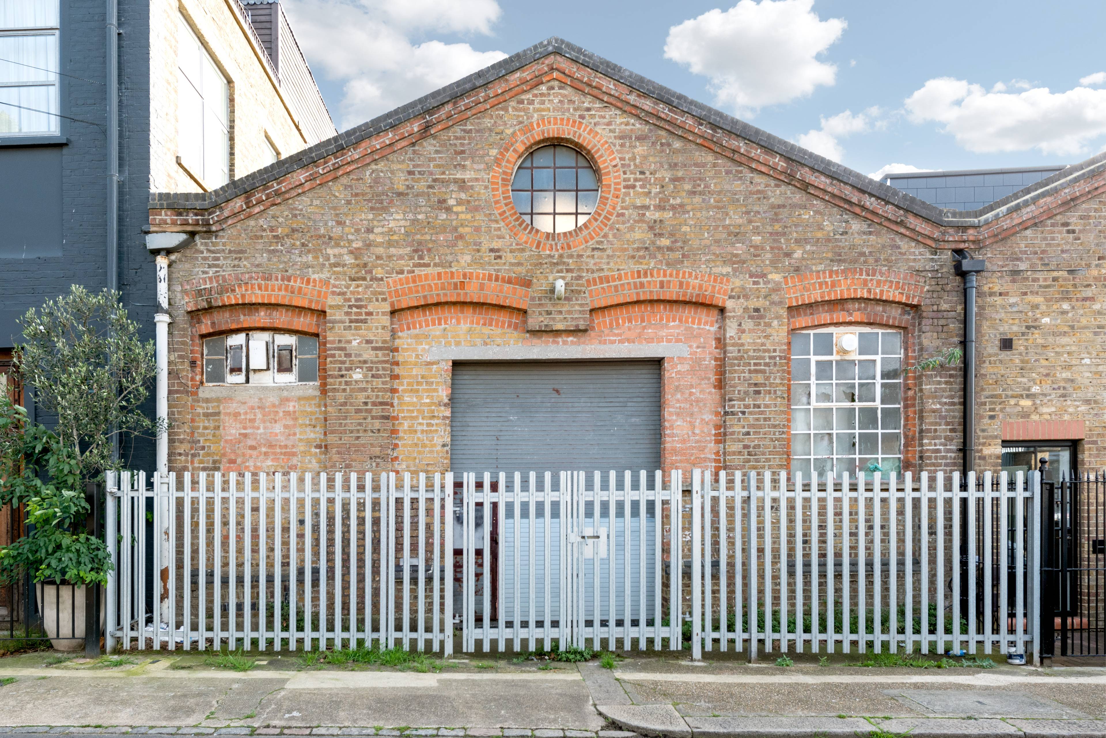 Development opportunity with full planning permission to convert an existing warehouse building into three residential apartments.