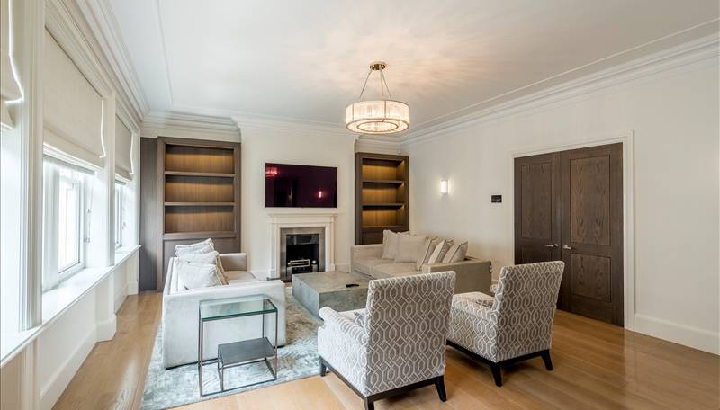 An exceptional three bedroom, north west facing, lateral apartment set within a Victorian red brick, Grade II listed, Queen Anne style period building.