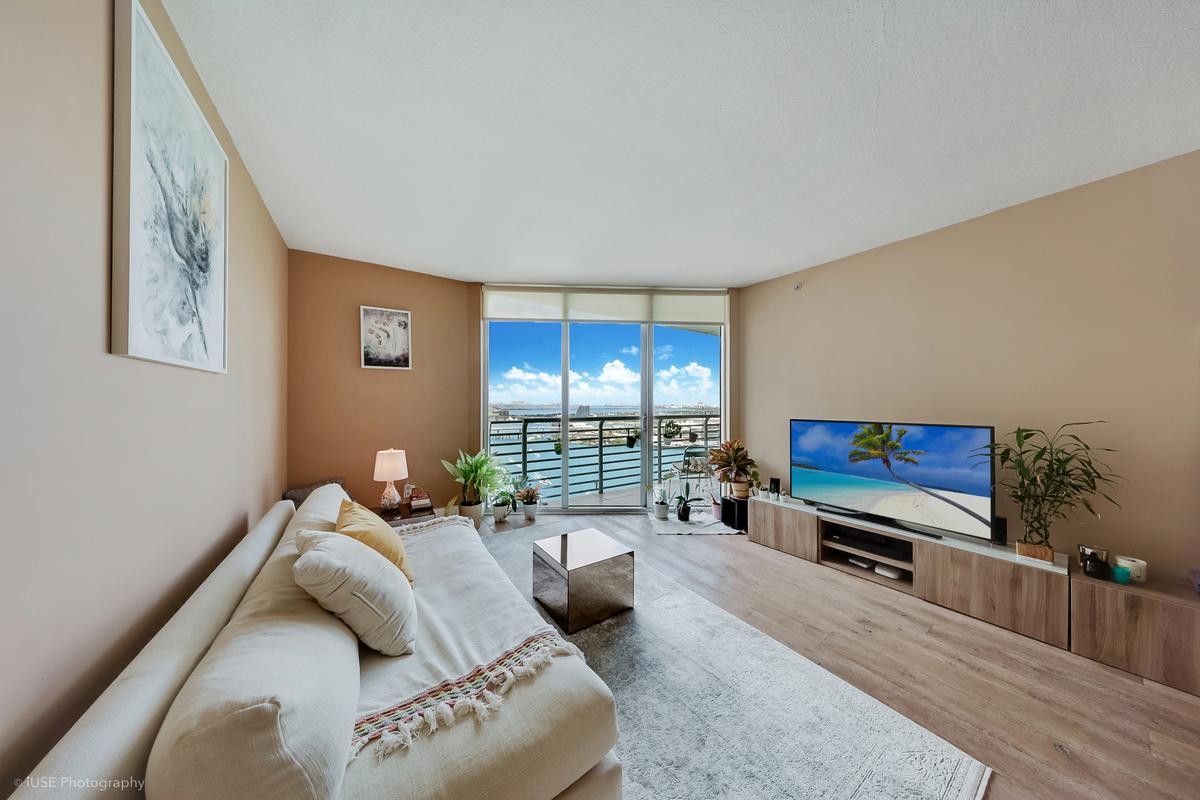 one-miami-east-3110-living-room-bay-view-floor-ceiling-glass-hardwood