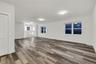 Spare room with wood finished floors and baseboards