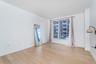 Unfurnished room with light wood-style floors and baseboards