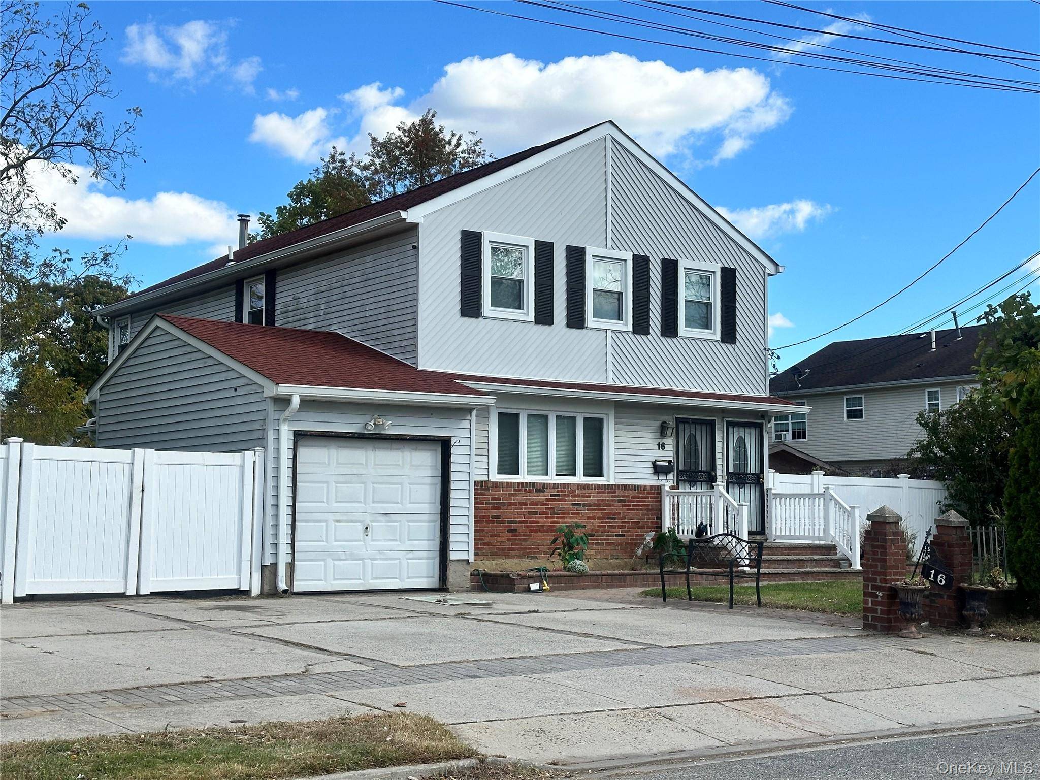 Welcome to this beautifully maintained two family home located in the heart of Roosevelt, Long Island.