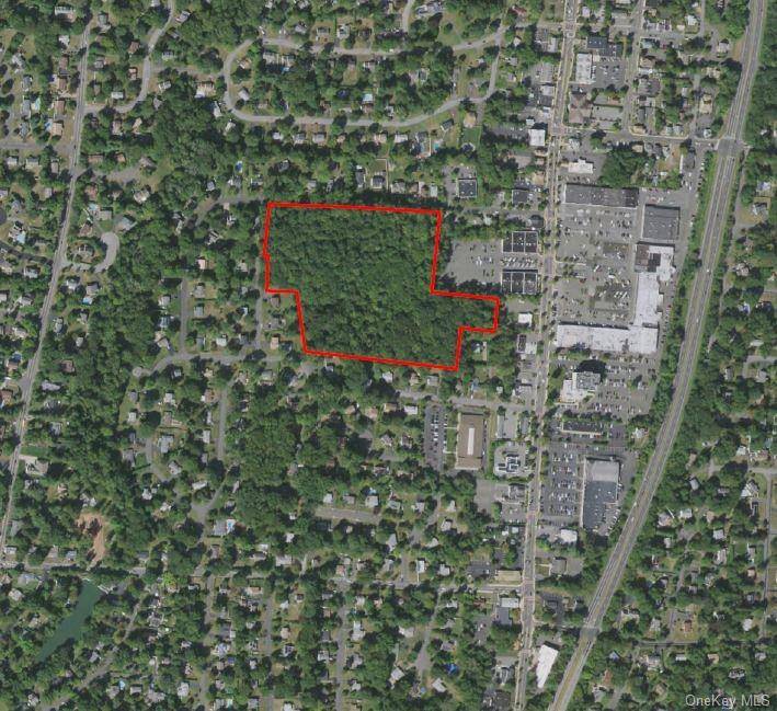 55 Schriever Lane, a rare and exciting opportunity to own a prime piece of land right in the heart of town, ripe for development.