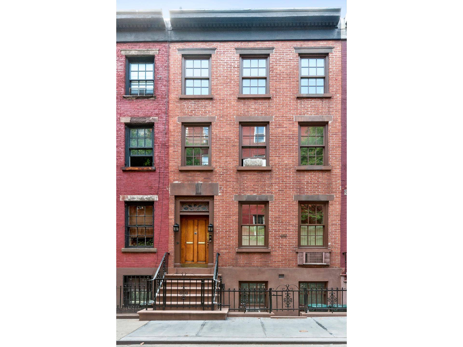 Located on a lovely block in historic landmarked Greenwich Village, this early 1839 Greek revival townhouse was built as one of four houses in a row.