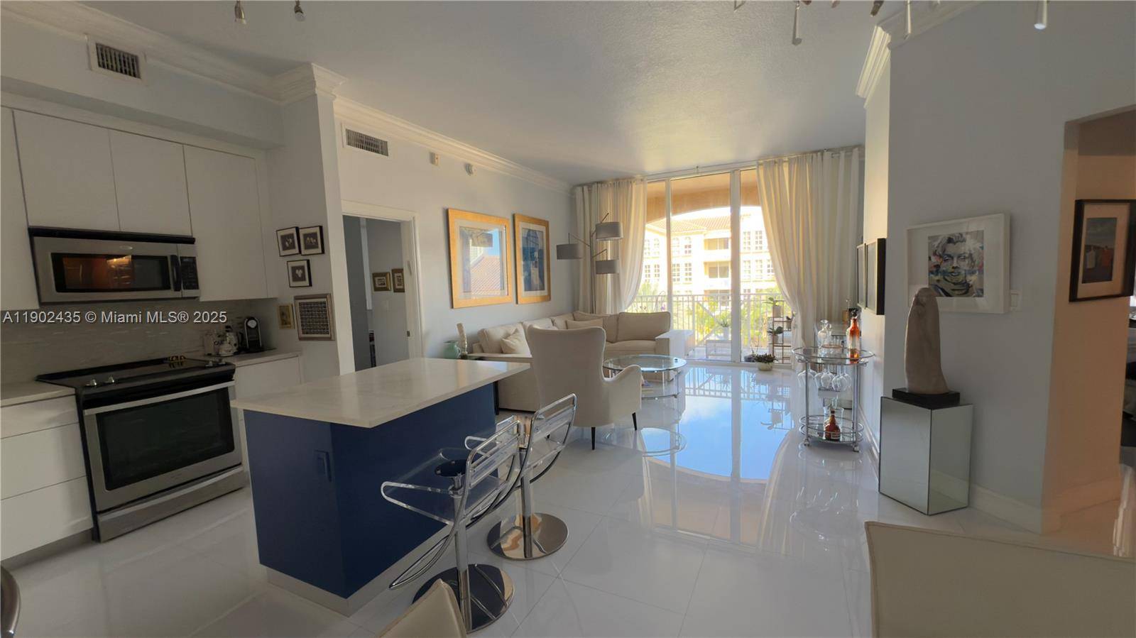 Stunning completely remodeled 2 bed 2 bath residence in the prestigious Alaqua Aventura featuring premium finishes, open concept living, and modern kitchen with high end stainless steel appliances.