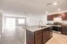 Great room standing by kitchen.