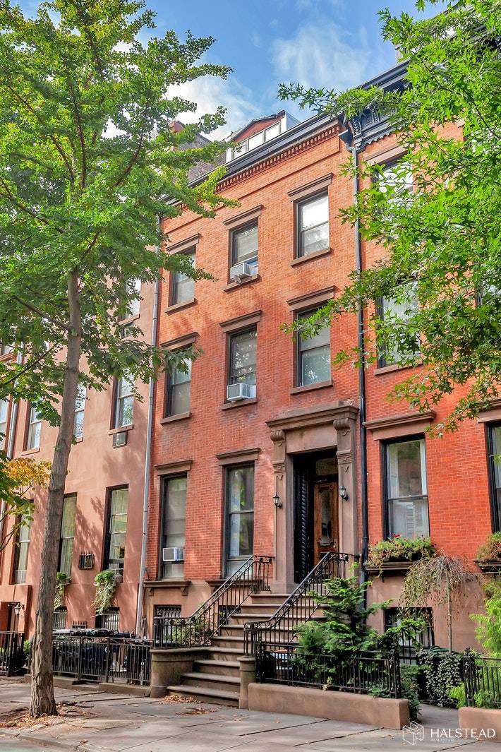 This gem of an 1850 Greek Revival townhouse could not be prettier or in a better location on Henry St.