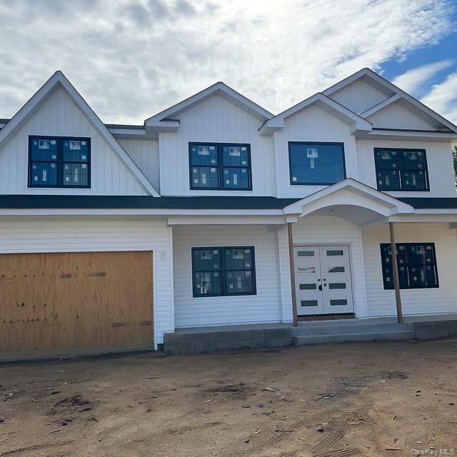 Experience luxury living in this stunning Center Hall Colonial located in the highly desirable Wantagh Woods section of Wantagh.