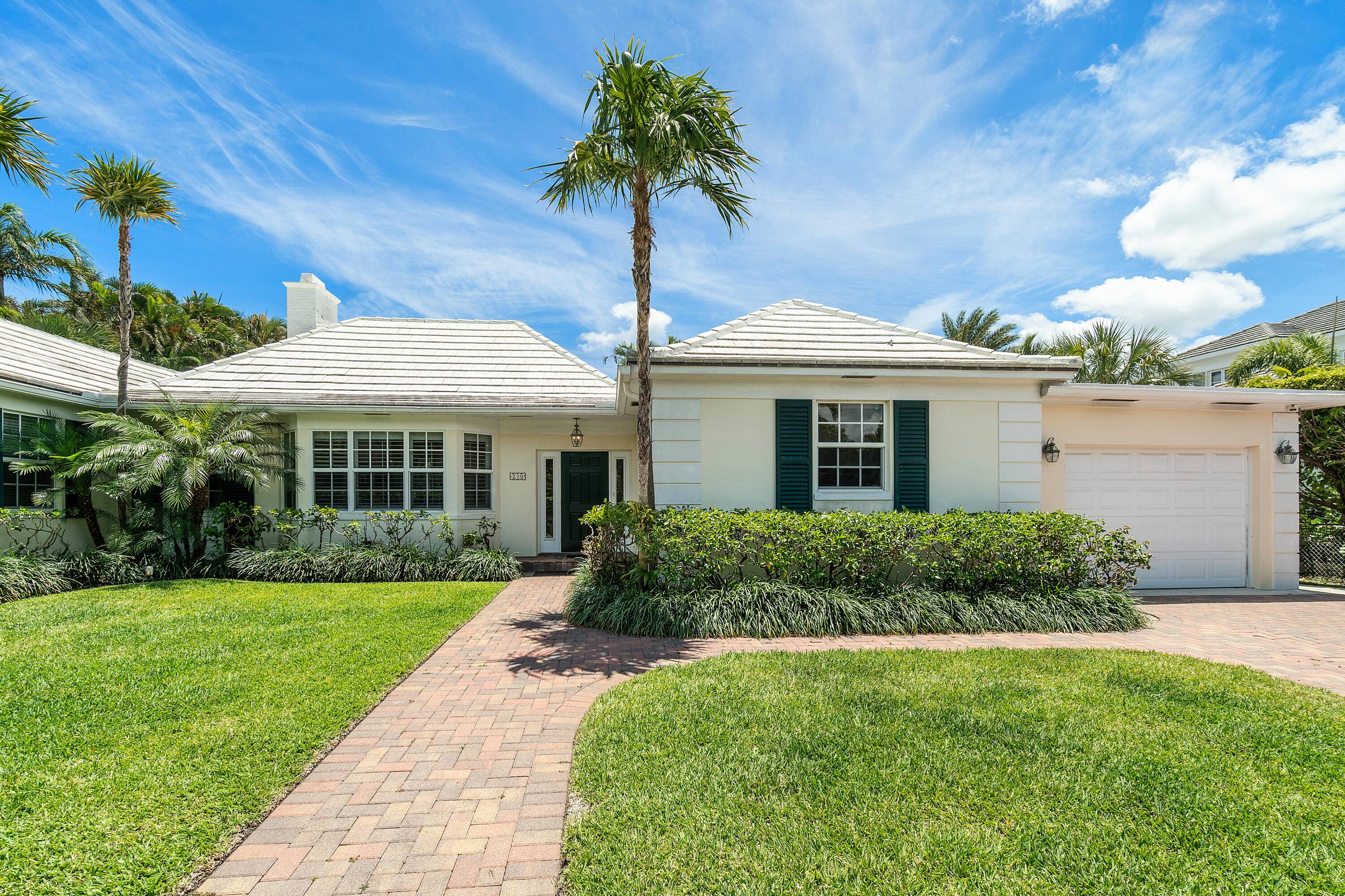 You will instantly relax in this charming beach house in the quiet north end of Palm Beach.