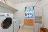 Laundry area accessible from the private suite.