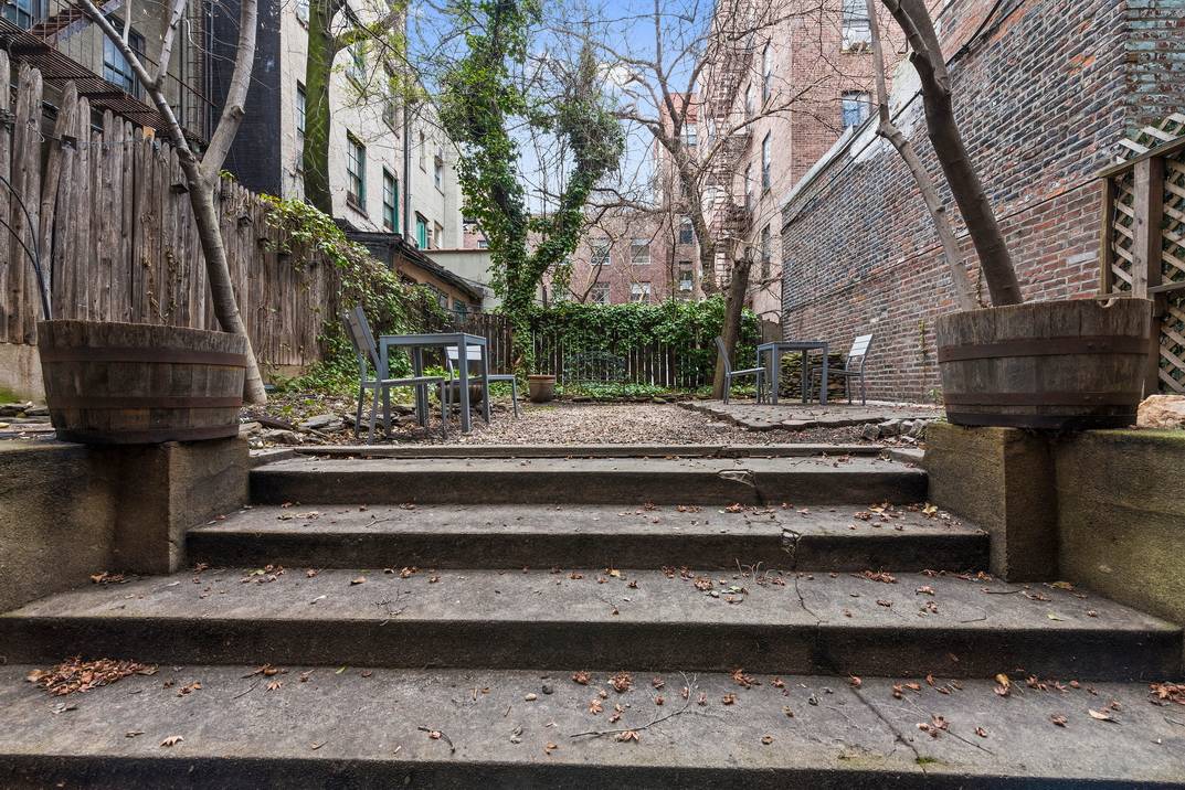 This full floor residence with a spacious, private garden is conveniently located in SoHo off of 6th Avenue and Prince Street.
