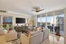 Marble flooring, water views, floor to ceiling glass, crown molding. Bright open and airy.