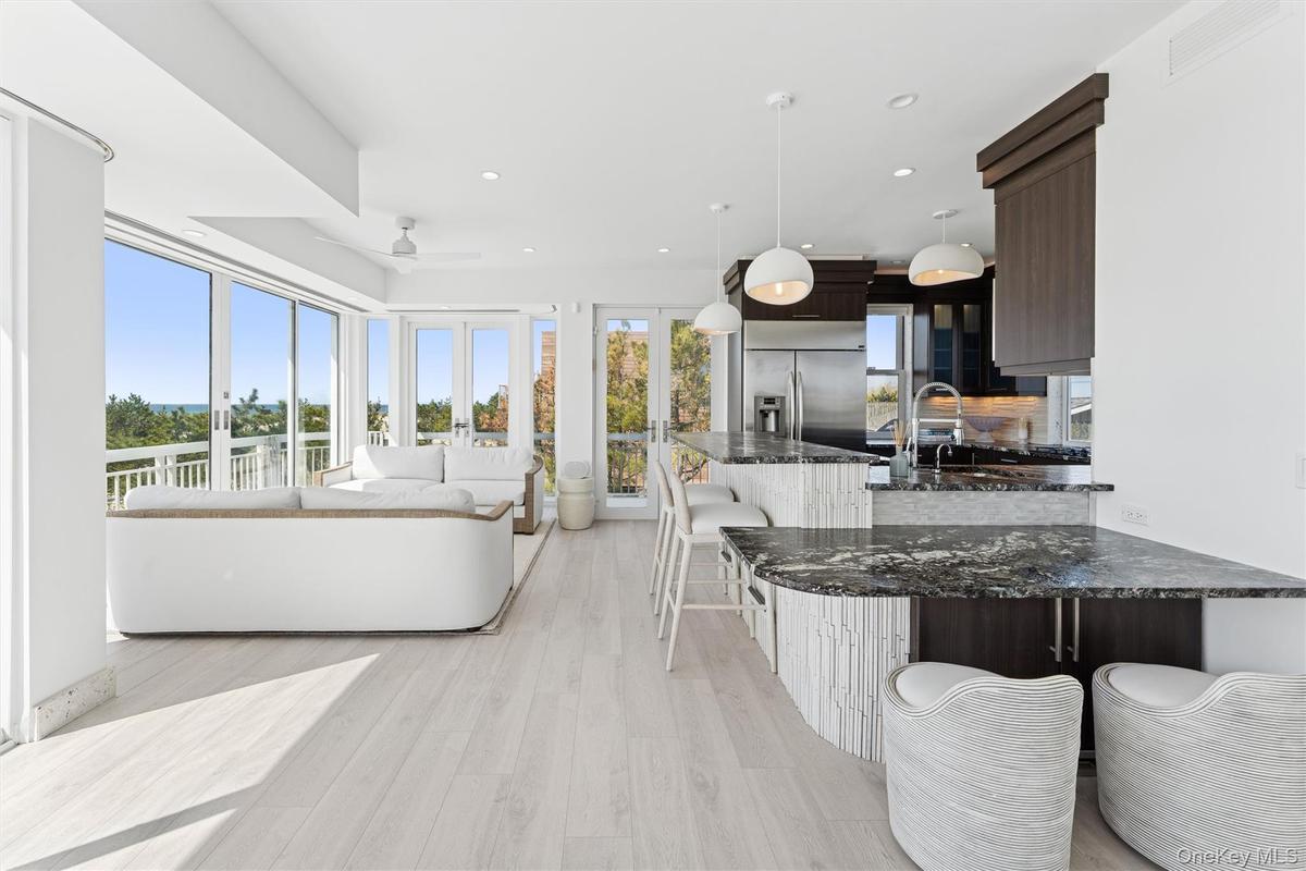 Living room featuring recessed lighting, a ceiling fan, visible vents, and light wood-type flooring