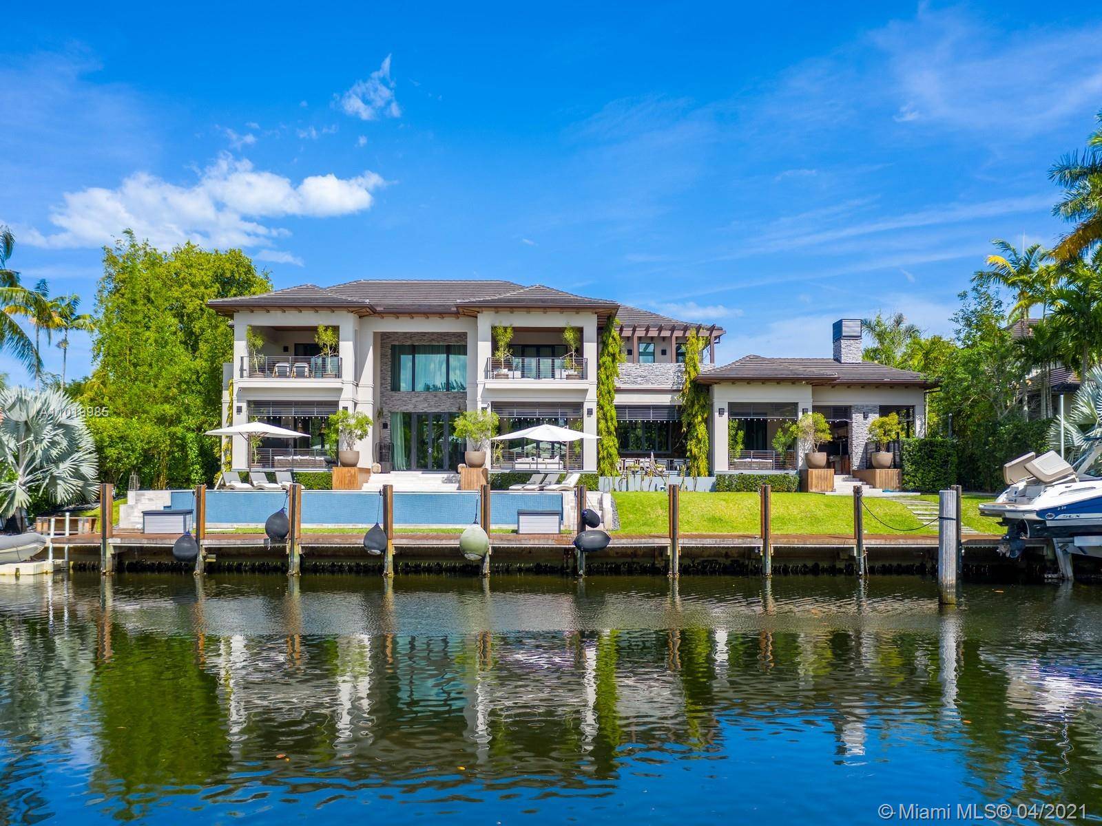 Dream CLASSIC CONTEMPORARY WATERFRONT home in the exclusive GATED Community of Old Cutler Bay in CORAL GABLES.