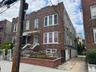 Traditional home featuring brick siding