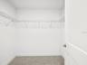 Primary Large walk in closet has many possibilities