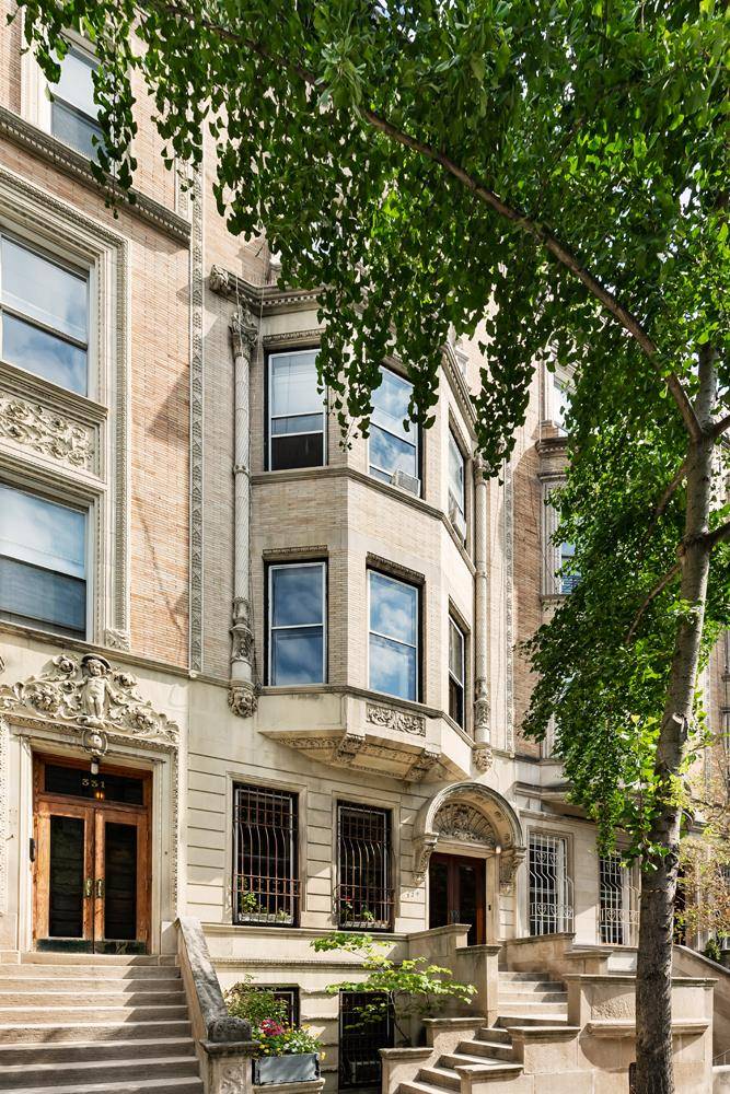 Delight in soaring ceilings, sun drenched rooms, and charming original details in this twenty foot, Riverside Park block townhouse.