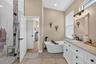 The primary EnSuite bath has double sinks, soaking tub and walk in shower