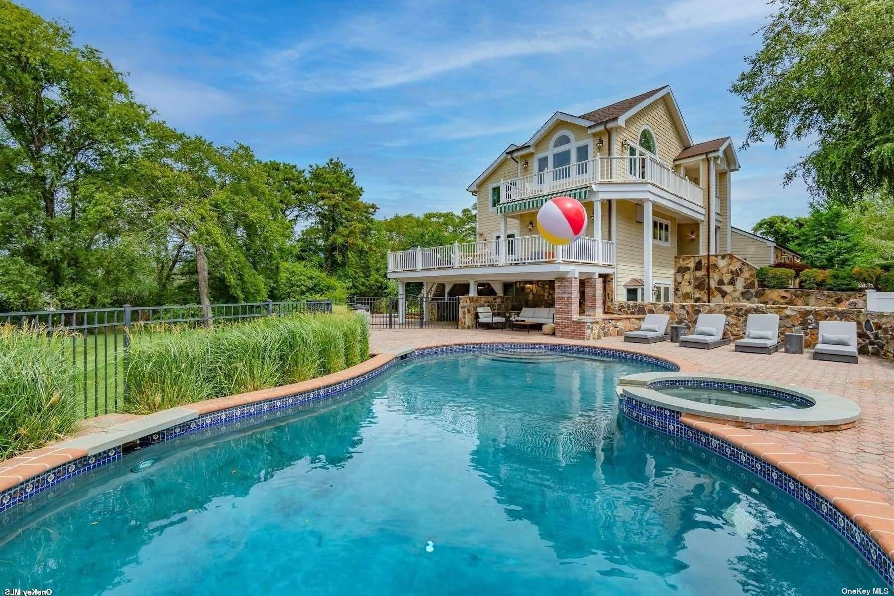 Luxury Living in this resort style home located in Hampton Bays.