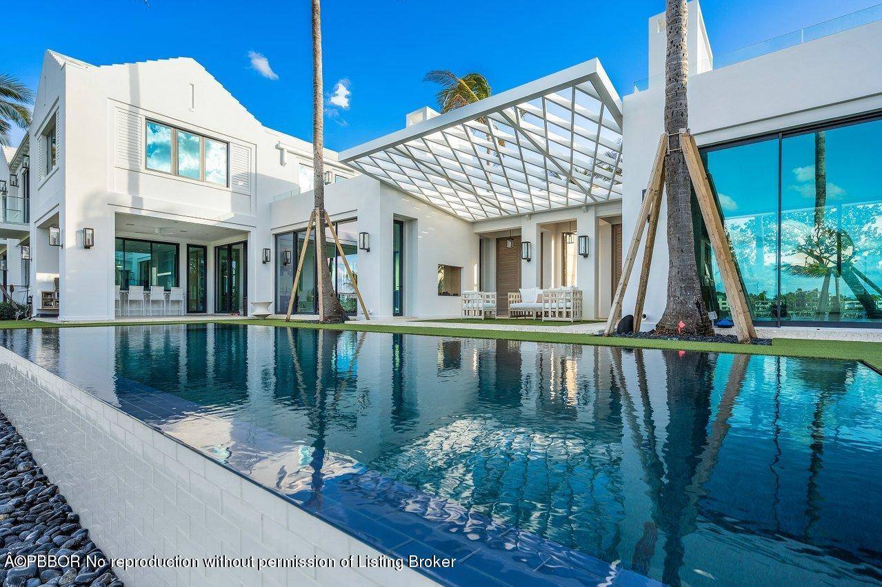 Direct oceanfront estate offering the most unique South Florida indoor outdoor living experience that is truly unrivaled.