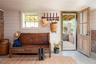 Living area with concrete floors and wooden walls
