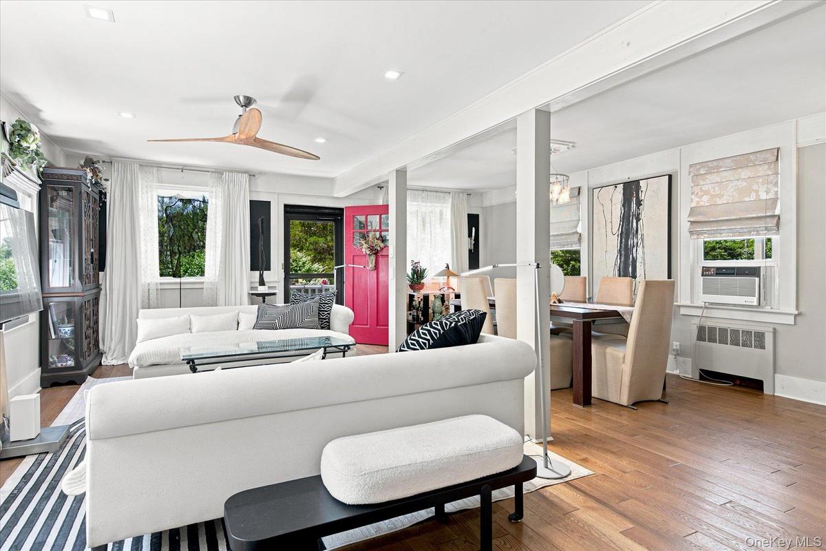 Gleaming hardwood floors and oversized windows fills your great room with plenty of natural light