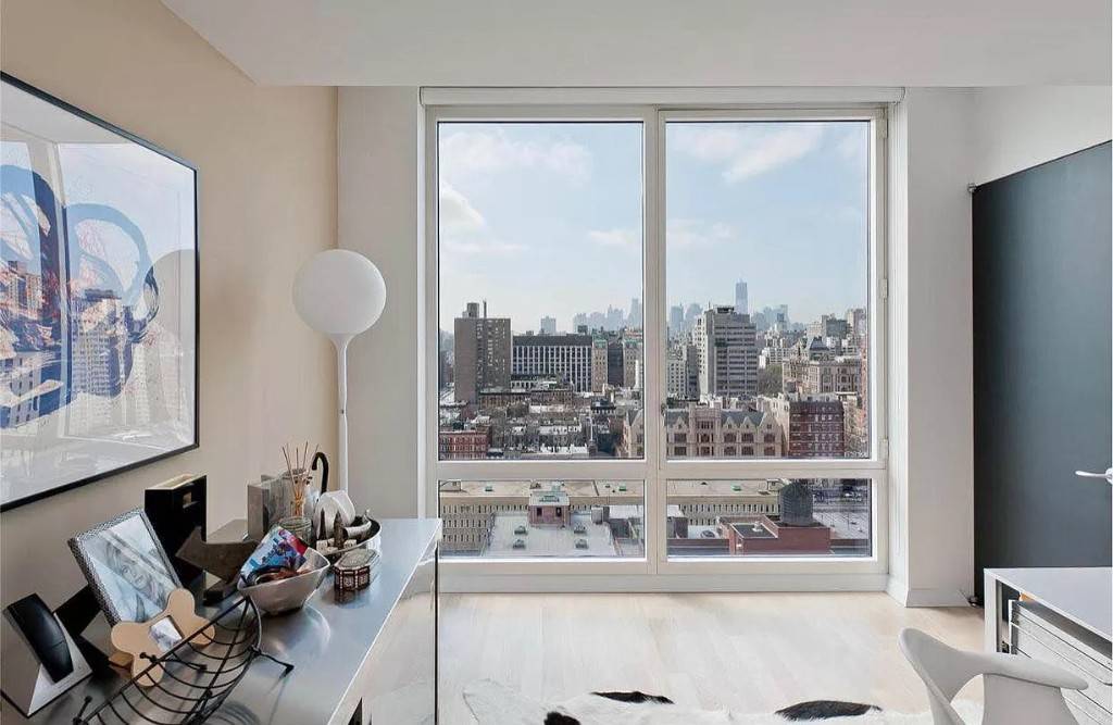 Incredible views of Downtown Manhattan from all of the floor to ceiling windows of this two bedroom two bath penthouse at the luxury Gramercy Starck condominium.