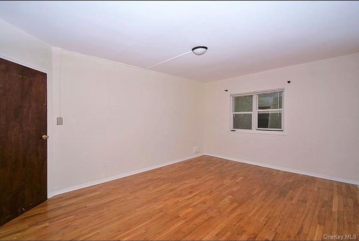 3rd Floor Bedroom featuring light wood-style floors and baseboards