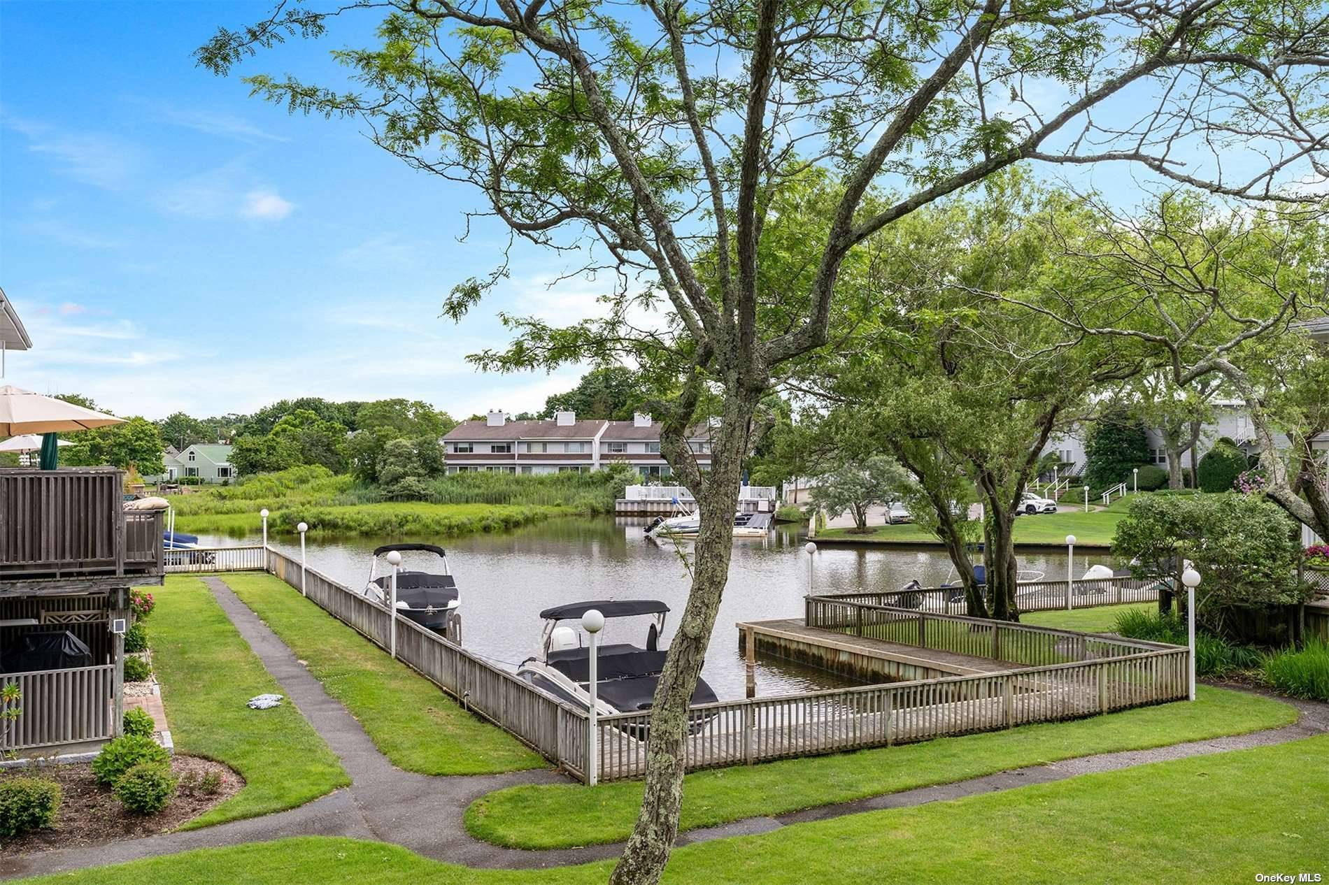 In the heart of the Village of Westhampton Beach, in the community of The Landings this renovated unit is the perfect summer offering with water views of the canal and ...
