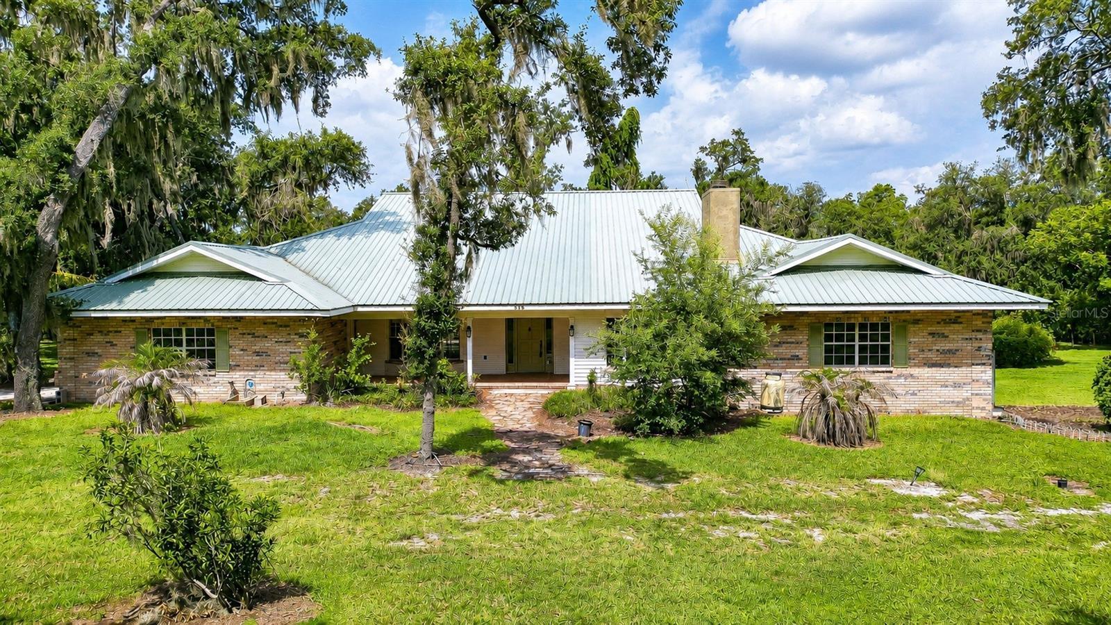 Custom-built one-owner estate on nearly two private acres.
