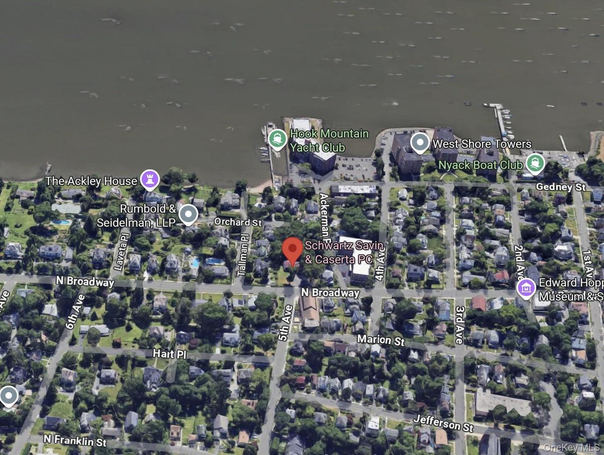 Aerial perspective of the property and its surrounding area.