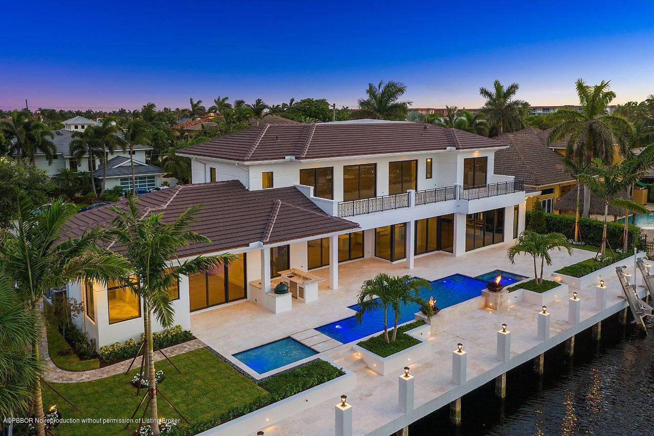 Brand New, Coastal Contemporary Waterfront Estate with 130 feet of protected deepwater, one lot off the Intracoastal on a cul de sac street in Tropic Isle, Delray Beach.