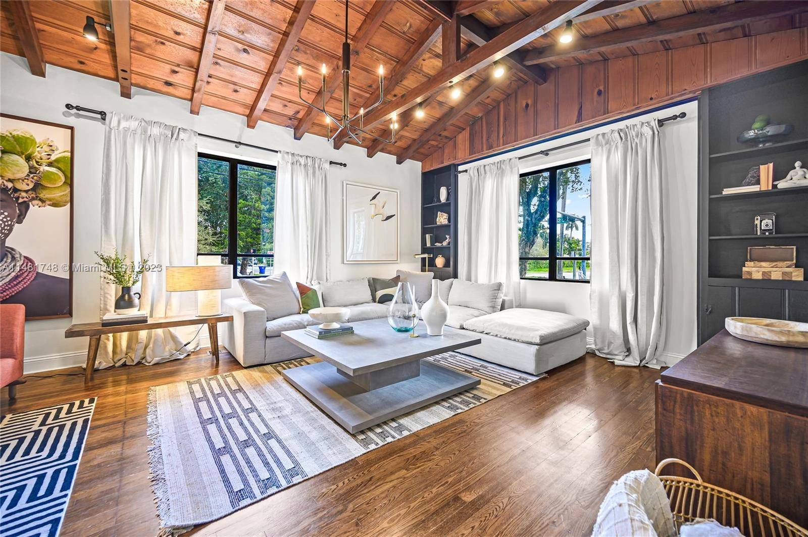 Charming Luxe Spanish style home in heart of Miami boasts lots of natural lighting and great outdoor entertainment space.