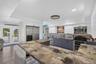 pdated kitchen featuring epoxy countertops, stainless steel appliances, and ample cabinetry.