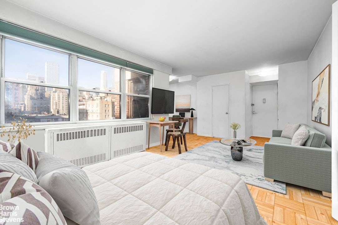 SKYLINE SERENADE HIGH FLOOR CORNER ALCOVE STUDIO with EMPIRE STATE SUNSETS The elevator goes whoosh, your key clicks, and you slip into a serene second from top, corner alcove studio ...