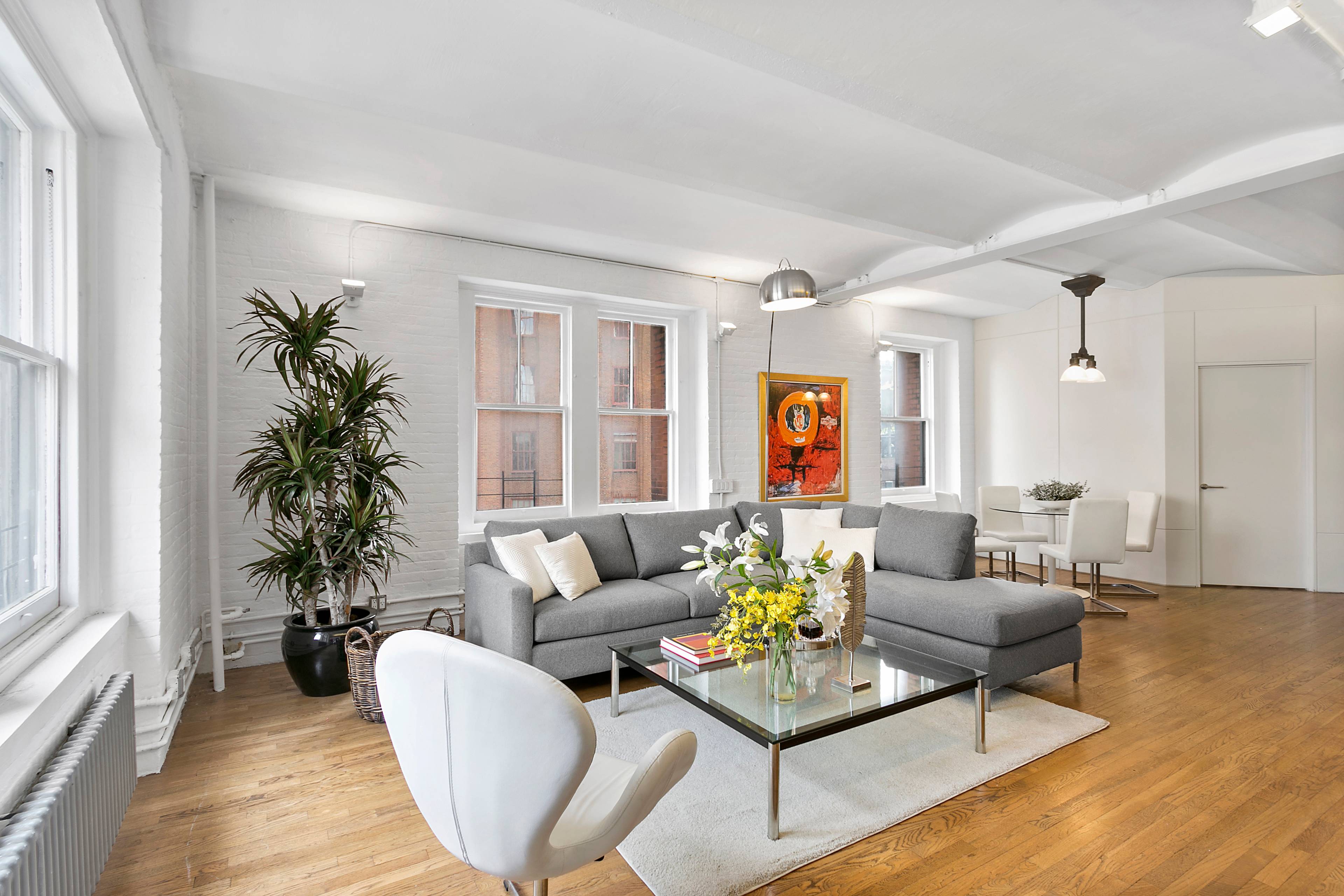 Welcome home to this rarely available, highly coveted 3 bedroom corner loft residence in the heart of TriBeCa.