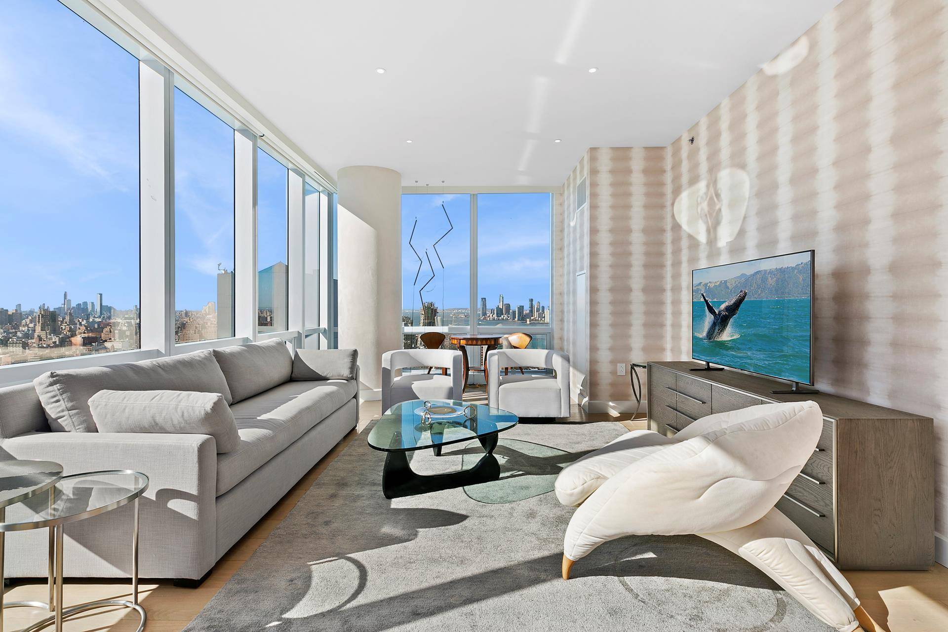 Corner 1, 777 square foot two bedroom, two and a half bath condominium combines sweeping Hudson River and New York City skyline views with the world class amenities of 15 ...