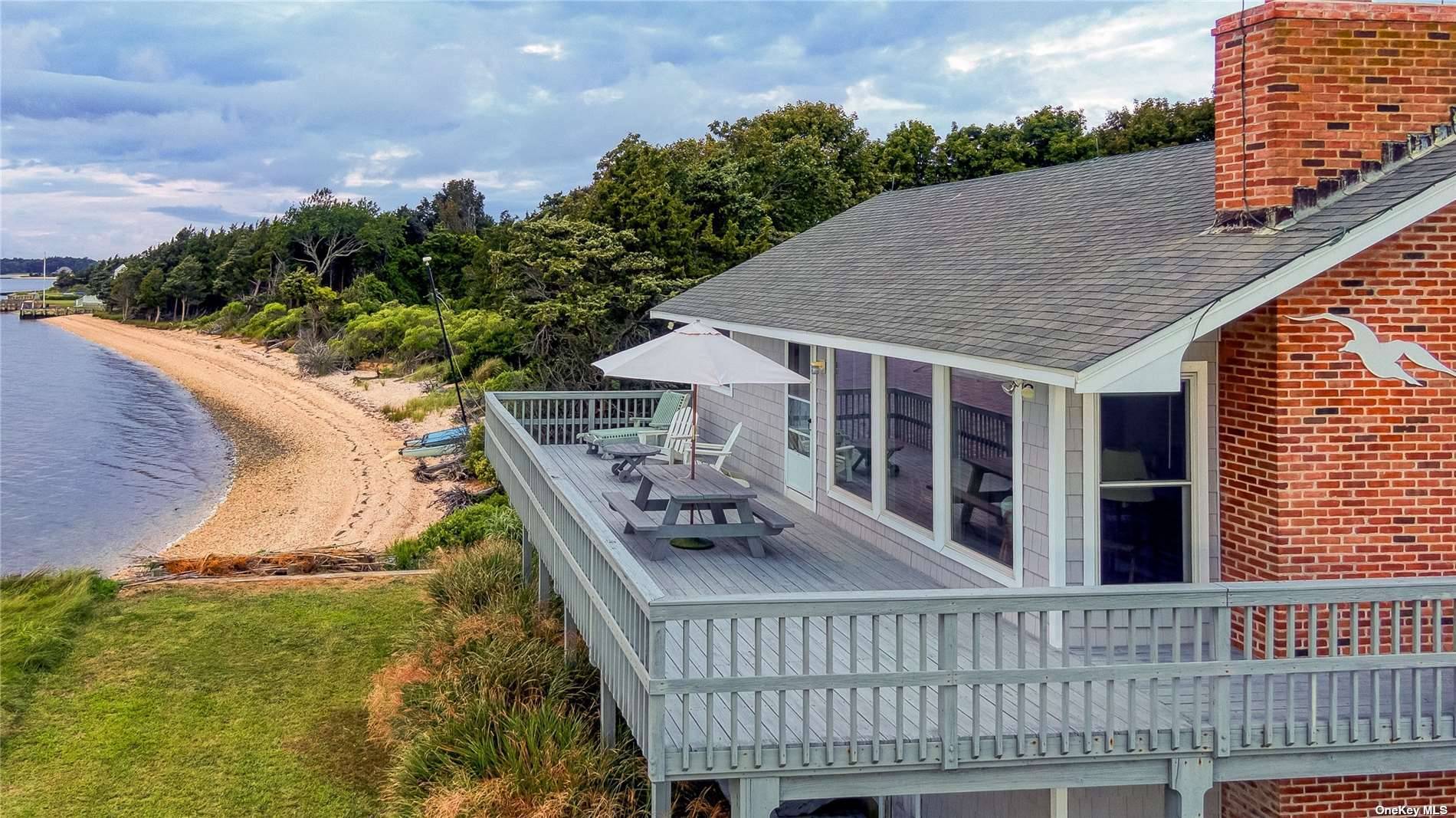 Welcome to 1355 Watersedge Way a delightful Bayfront home located on Little Peconic Bay in Southold.