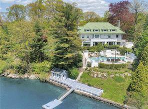 Notable waterfront compound in coveted Chimney Cove with panoramic vistas across Long Island Sound.