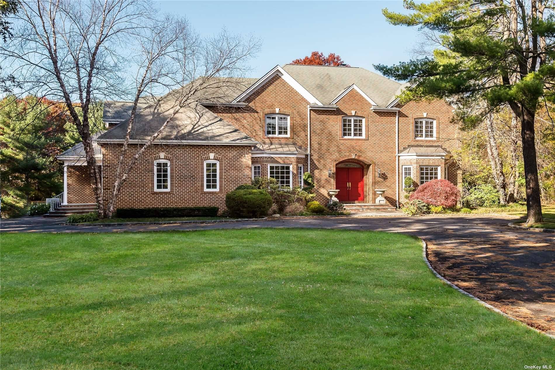 Traditional Brick Colonial located on a private road.