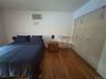 First Floor Bedroom #1 Queen size Bed, Closet, Dresser, Nightstand, Chair, A/c Wall unit.