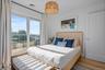 Bedroom with wood finished floors