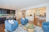 Open concept living space featuring wood-finish flooring