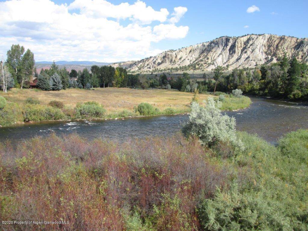 The best of the best ! Boasting over 305 feet of highly desirable Roaring Fork River frontage and adjacent to a BLM parcel which protects the fantastic view of Mt.