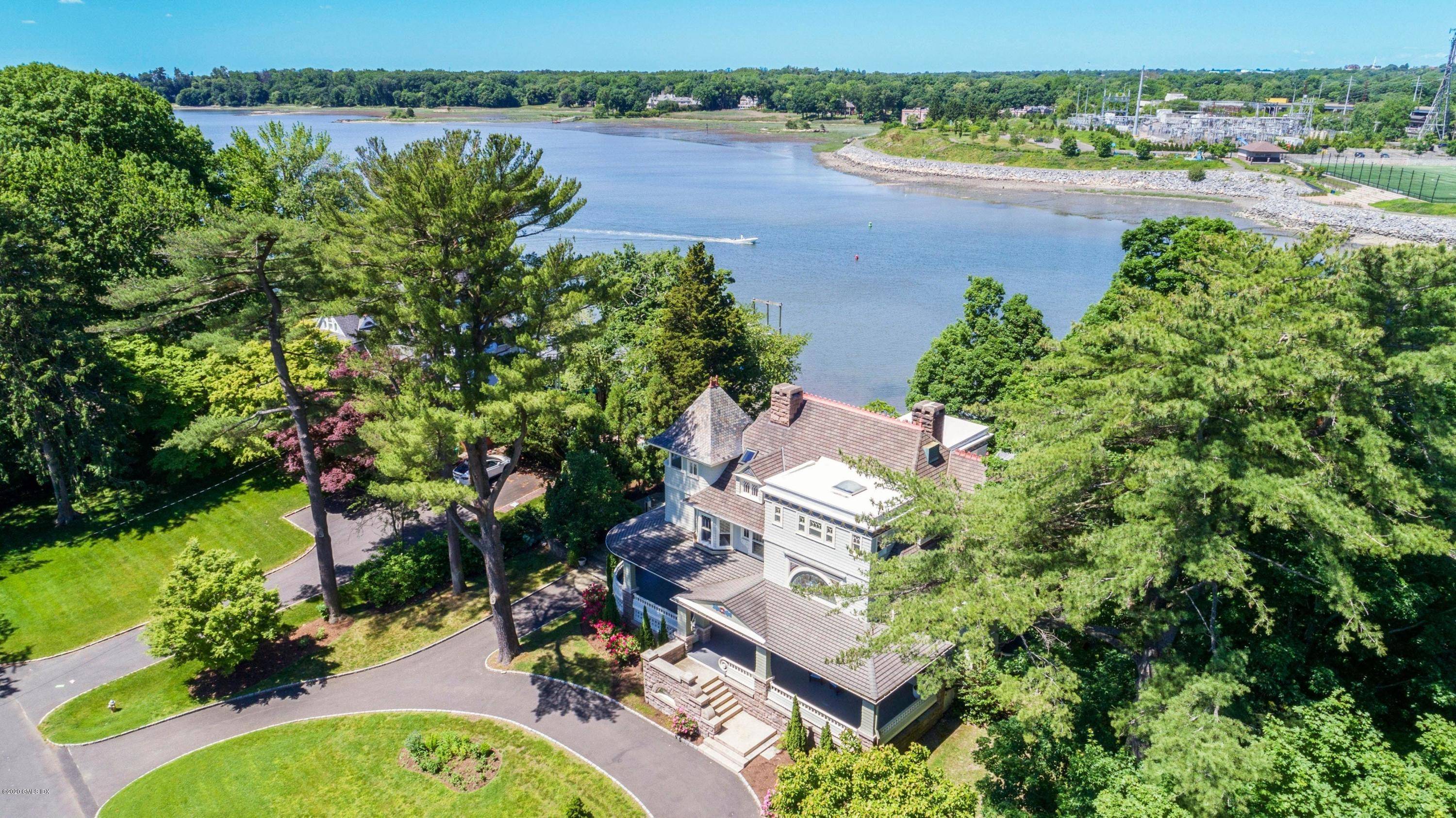 Majestic waterfront home high above the Cos Cob harbor.