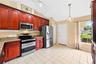 The Kitchen overlooks the Family Room and is ready for the home chef with NEW STAINLESS STEEL APPLIANCES, granite countertops, an abundance of wood ca
