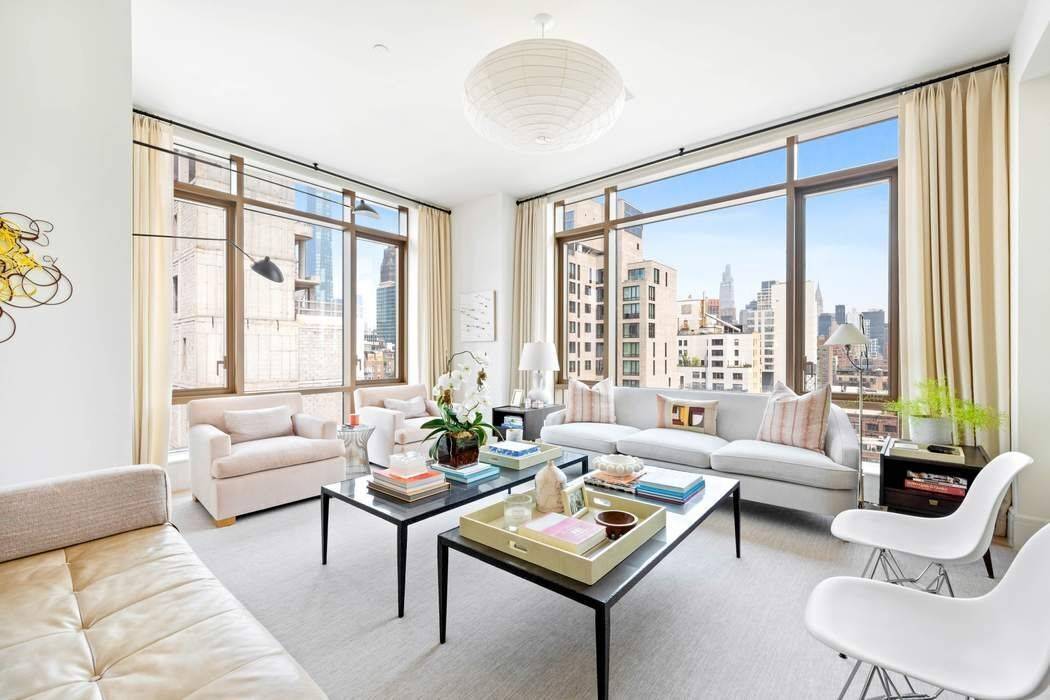 Perched high on the 12th floor, with an abundance of natural light and iconic city skyline views, this gracious 4 bedroom, 4.