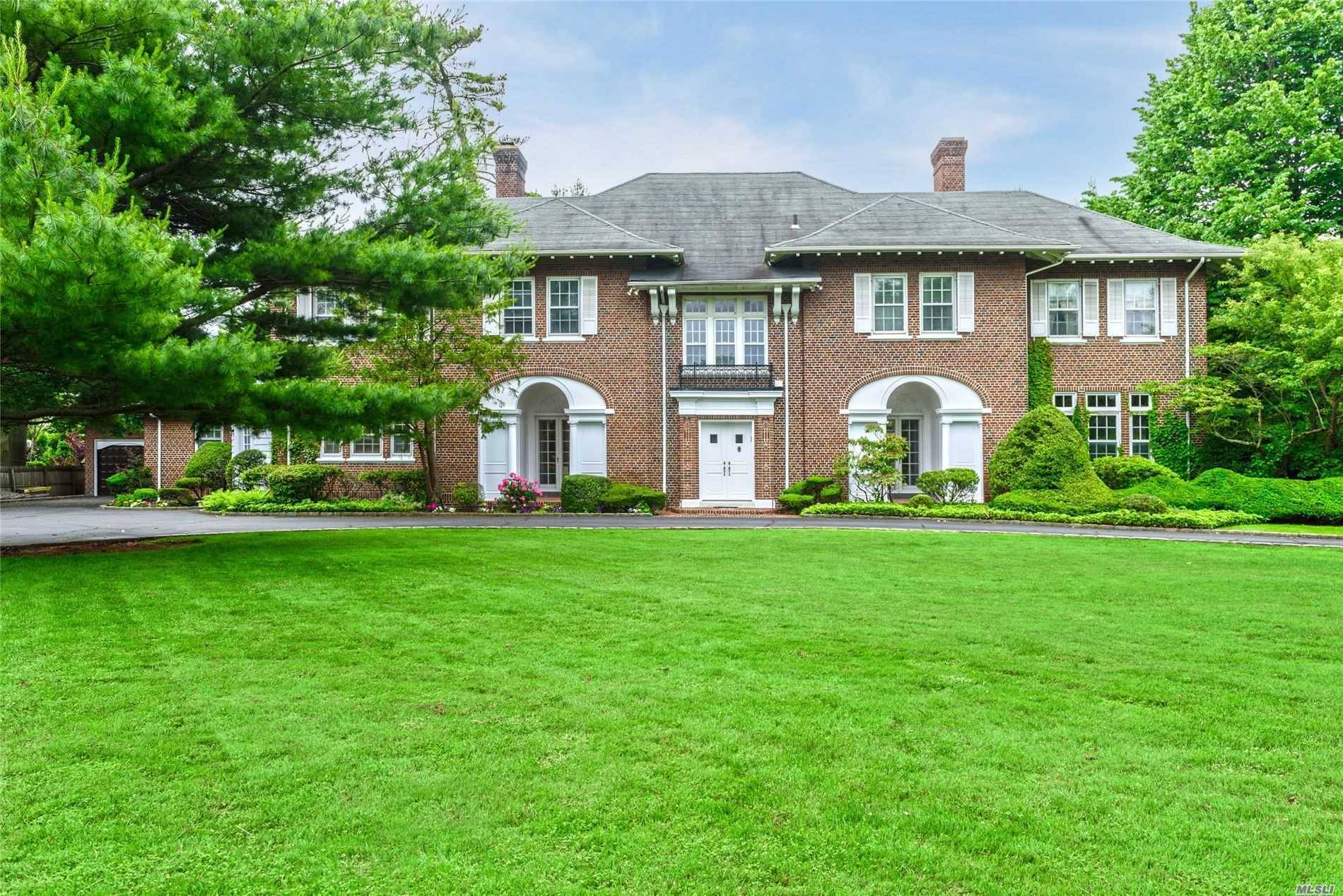 This breathtaking Woodsburgh estate is over 8000 sq ft amp ; is situated on almost an acre of spectacularly landscaped grounds, serenely tucked away with lush gardens.