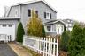 View of front of home featuring a fenced front yard and stucco siding