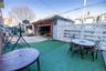 View of patio / terrace with an outbuilding, outdoor dining space, and a garage
